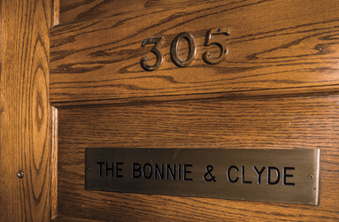 a sign on a wooden surface